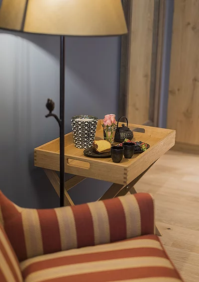 Arm chair and floor lamp in the Premium double room in the Hotel Unterschwarzachhof