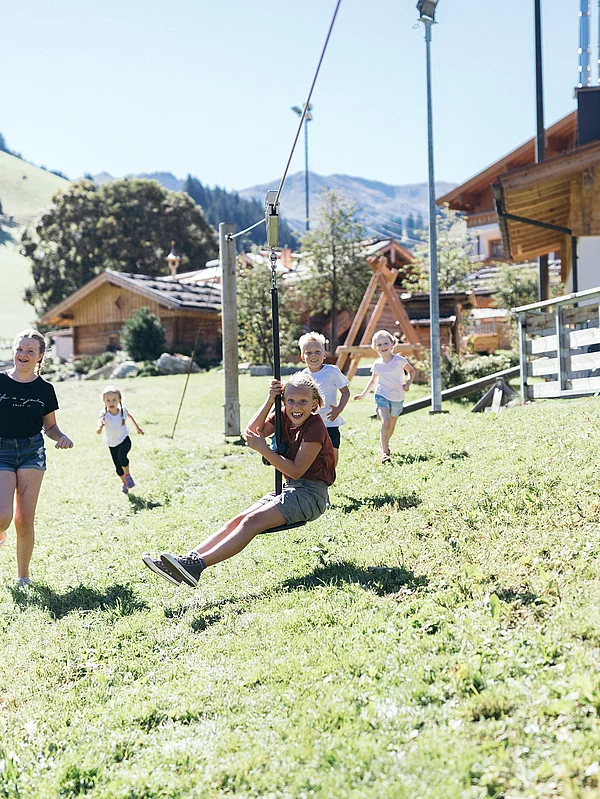Children on the playground at the Hotel Unterschwarzachhof in Saalbach Hinterglemm