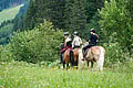 Teenagers out on a hack ride with horses from the Hotel Unterschwarzachhof