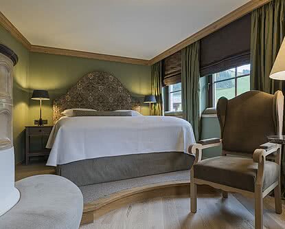 Doppelbett in der Familiensuite Deluxe im Hotel Unterschwarzachhof