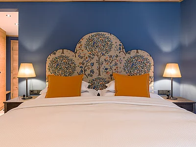 Bett im Doppelzimmer Premium im Hotel Unterschwarzachhof