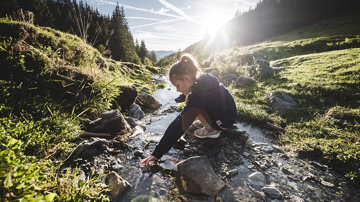 Playing in a stream at the head of the valley in Saalbach Hinterglemm