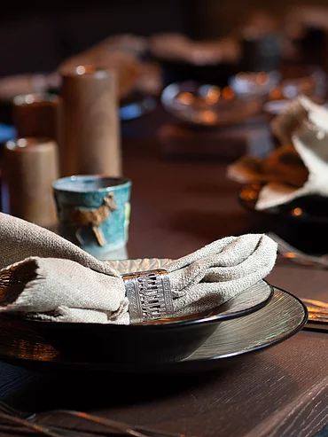 Table setting in the Riding Room in the horse stables at the Hotel Unterschwarzachhof