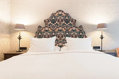 Doppelbett Familiensuite Deluxe im Hotel Unterschwarzachhof
