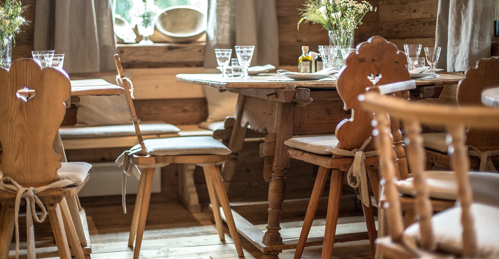 Tables and chairs in the Alpine inn, Landwirtschaft Hotel Unterschwarzachhof