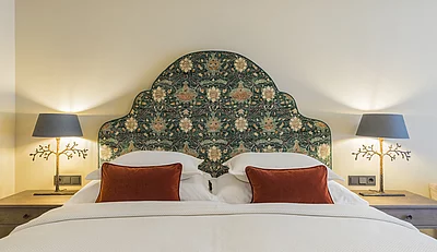 Double bed in the Deluxe family suite in the Hotel Unterschwarzachhof